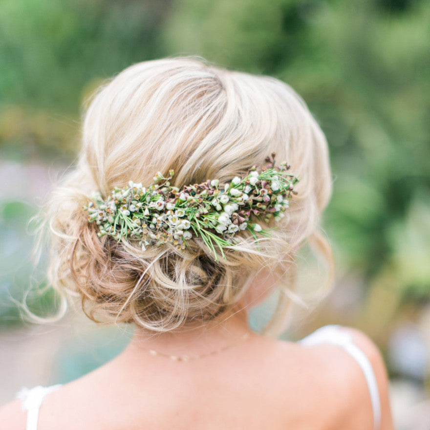 Photo of An open hairstyle with baby's breath and small yellow flowers